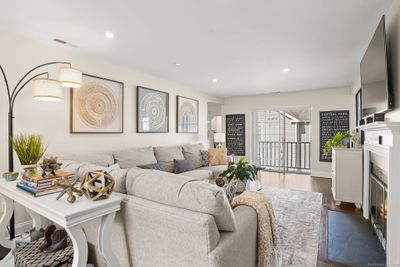 Open and bright Living Room with sliders to private deck. | Image 3