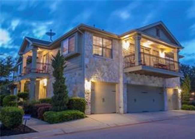 View of front of property, a garage, the balcony, and driveway | Image 30