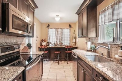 Kitchen featuring sink, stainless steel | Image 2