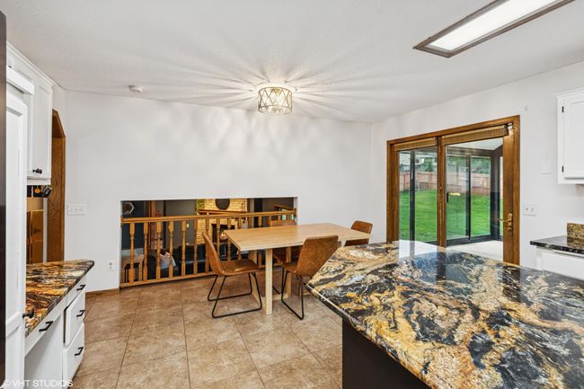 Just off the kitchen and dining room, the 3-season porch is perfect for morning coffee or evening chats | Image 18