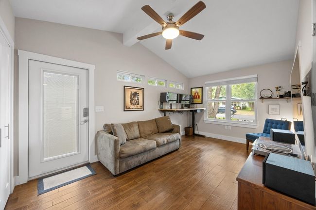 Living room featuring hardwood / wood-style flooring and a ceiling fan | Image 16