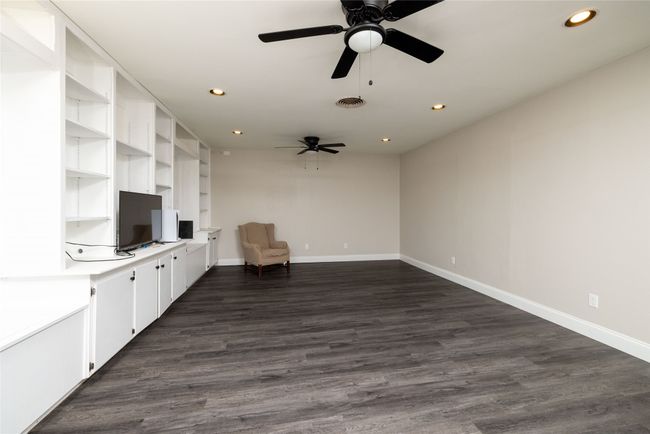 Unfurnished room with ceiling fan, visible vents, recessed lighting, dark wood-style flooring, and baseboards | Image 5