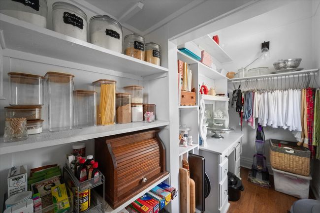 Walk in closet with wood finished floors | Image 16