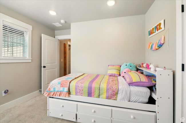 Bedroom with light carpet and recessed lighting | Image 13