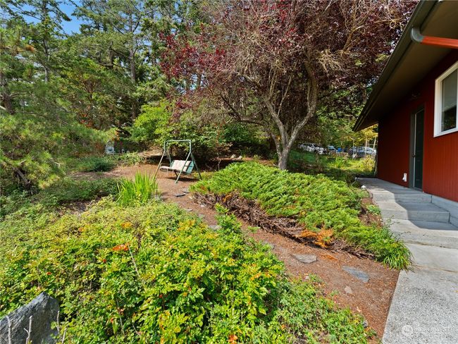 A pretty good-sized fenced garden area from road and alongside the garage. | Image 4