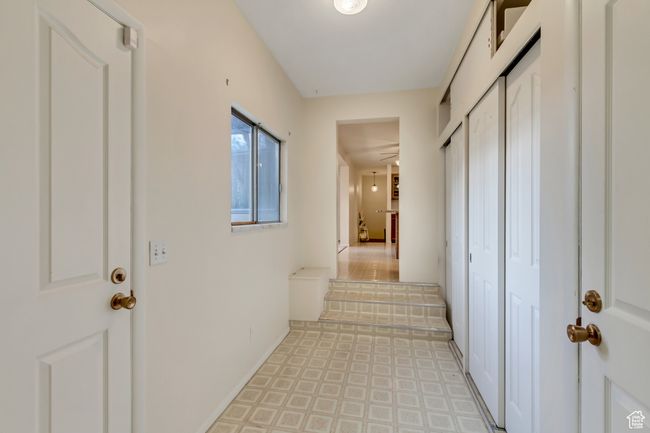 Corridor with baseboards and light floors | Image 9