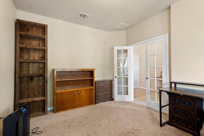 Study space featuring french doors. | Image 17