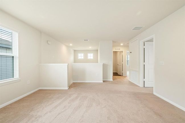 Upstairs, a spacious game room, perfect for family fun, hobbies, or relaxing with friends. | Image 14