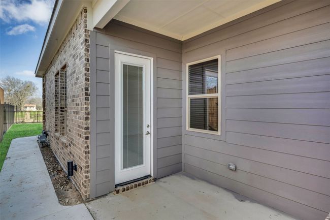 Doorway to property with a patio area | Image 26