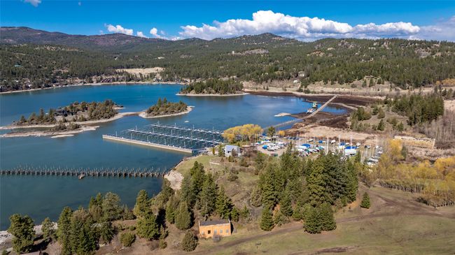 Birds eye view of property with a view of trees and a water and mountain view | Image 65