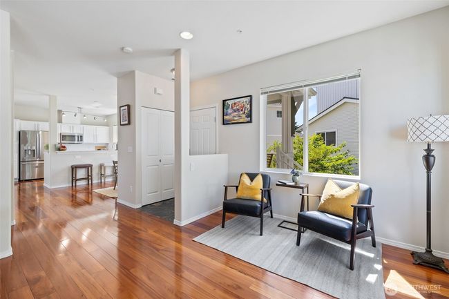 View of the reading/sitting space showing entry and a view of the dining room | Image 11
