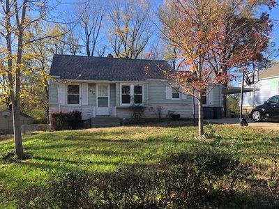 View of front of home with a carport and a front lawn | Image 1