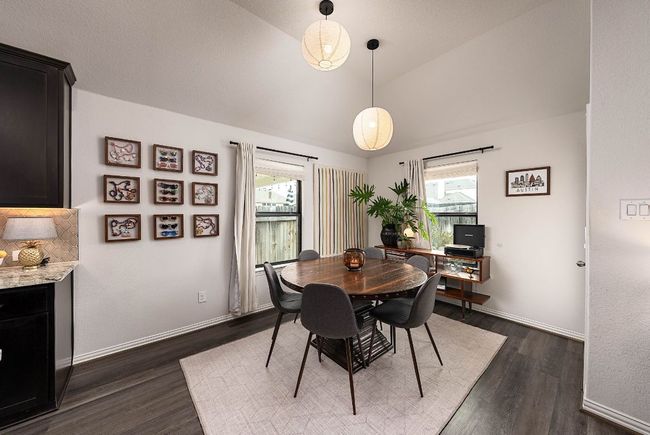 Dining area with vaulted ceiling | Image 8
