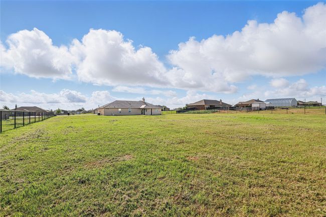 View of yard with fence | Image 27