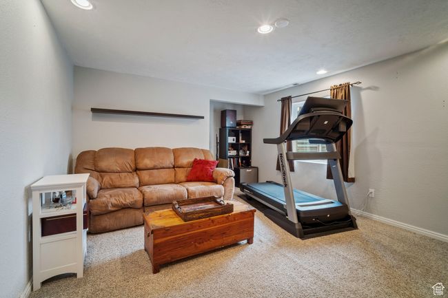 Carpeted living area featuring recessed lighting and baseboards | Image 21