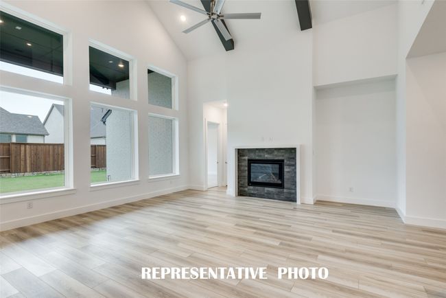Spacious and light filled, this family room is large enough to host the entire family! REPRESENTATIVE PHOTO. | Image 9