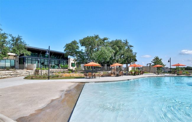 Community pool with fence and a patio area | Image 39
