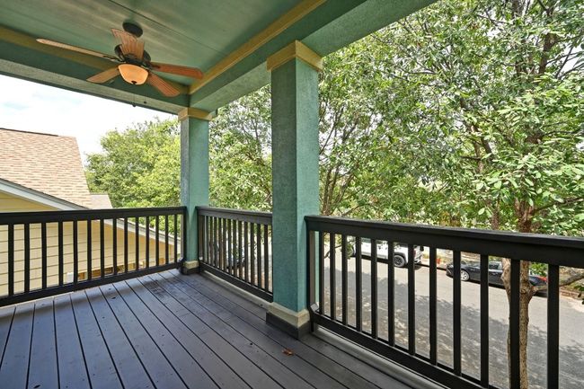 East facing front balcony featuring ceiling fans | Image 30