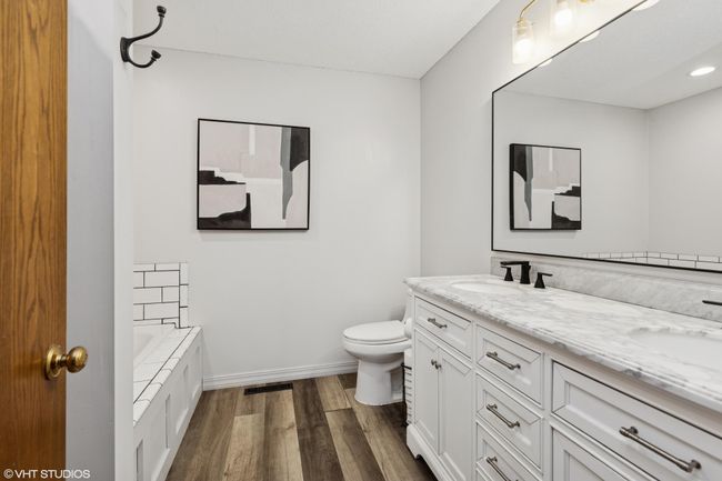 Updated primary ensuite featuring soothing neutral tones for a timeless look | Image 24