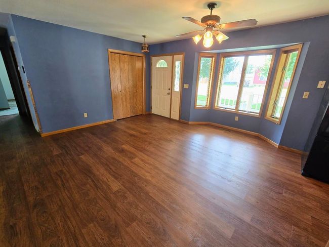 Dining area with bay window overlooking covered porch area on south side | Image 11