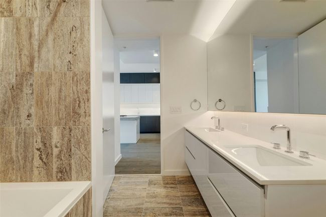 Full bath with double vanity, a tub, and a sink | Image 25
