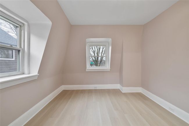 Empty room featuring plenty of natural light, light wood-style floors, and baseboards | Image 15