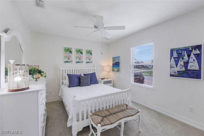 Carpeted bedroom with ceiling fan | Image 16