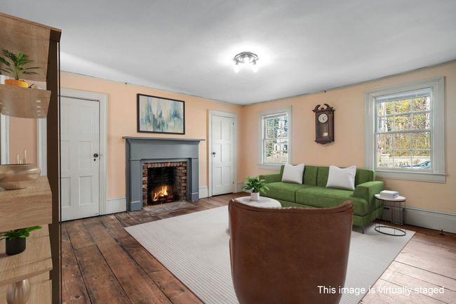 Same room, opposite perspective. First floor space with fireplace, could be an office or retail. Yes, wide plank Hickory flooring. | Image 8