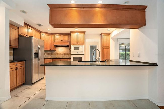 13310 Golf Crest Cir, House other with 6 bedrooms, 3 bathrooms and null parking in TAMPA FL | Image 13