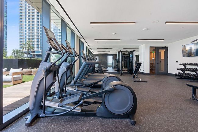 Workout area featuring a city view | Image 36