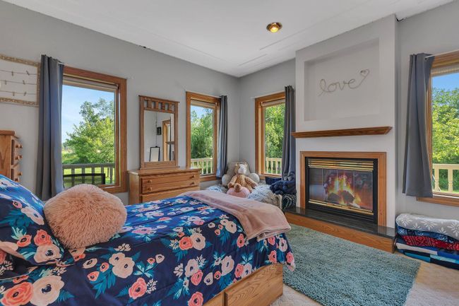 Bedroom with a fireplace | Image 39