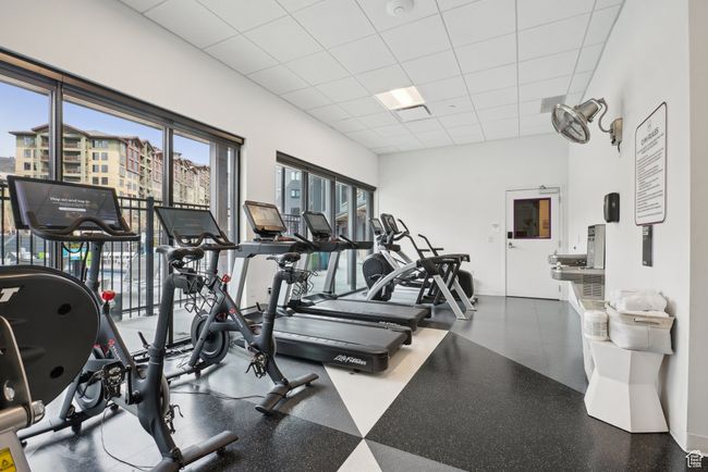 Exercise room featuring a paneled ceiling | Image 38