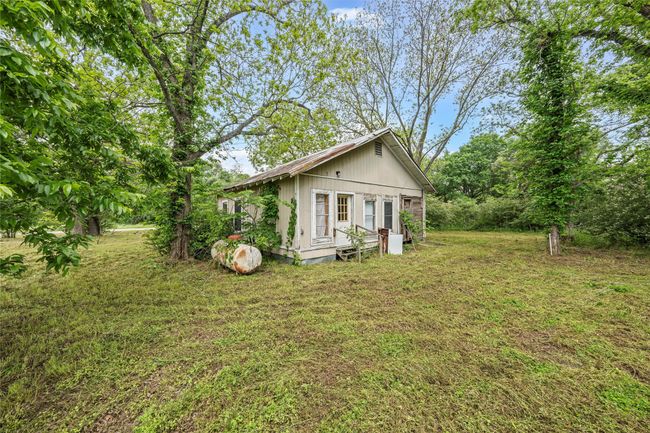 View of side of property with a yard and an outdoor structure | Image 13