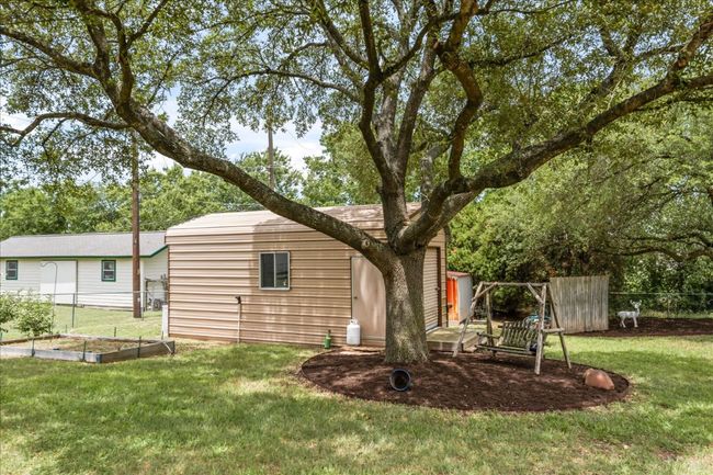 Back of house with a vegetable garden | Image 30