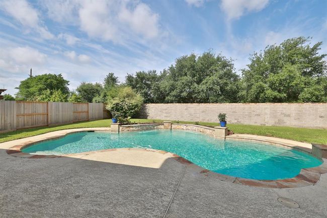 35 foot chlorine pool and is 8 foot at deep end. Sheer descent water feature and pool light. | Image 38