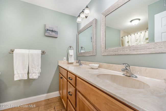 Upstairs Bathroom with Dual Sinks, Solid Surface Countertops & Shower/Tub Combo | Image 28