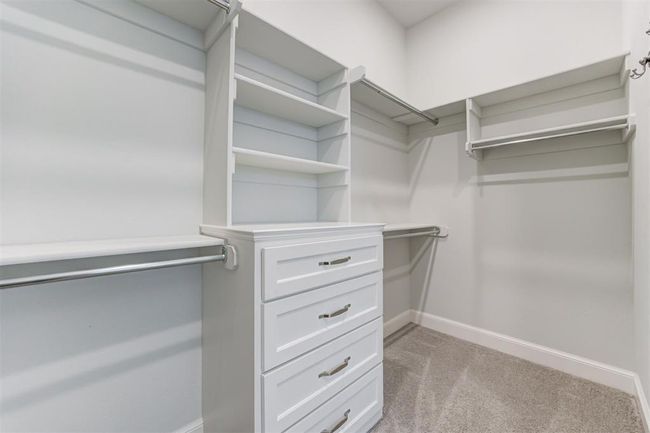 Primary closet with built-ins and plenty of storage. | Image 21