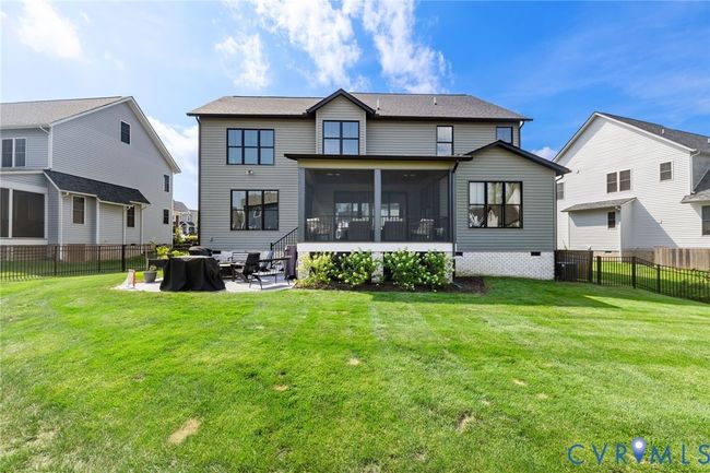 Back of house featuring a sunroom, a fenced backyard, a patio area, and crawl space | Image 45