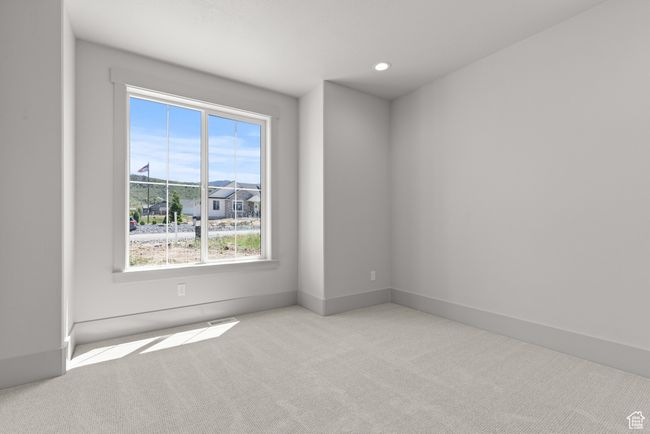 Carpeted empty room with plenty of natural light and recessed lighting | Image 18
