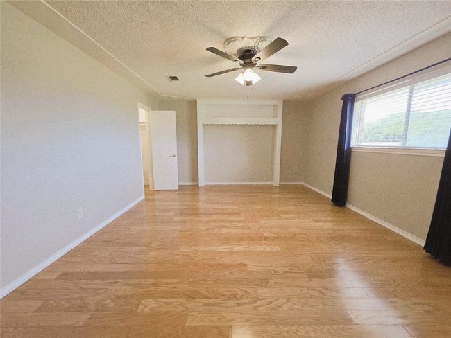 Bathroom featuring wood finished floors, vanity, and an enclosed shower | Image 18