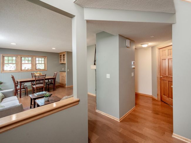 Step inside to a welcoming view of the bright and open living and dining spaces. | Image 6