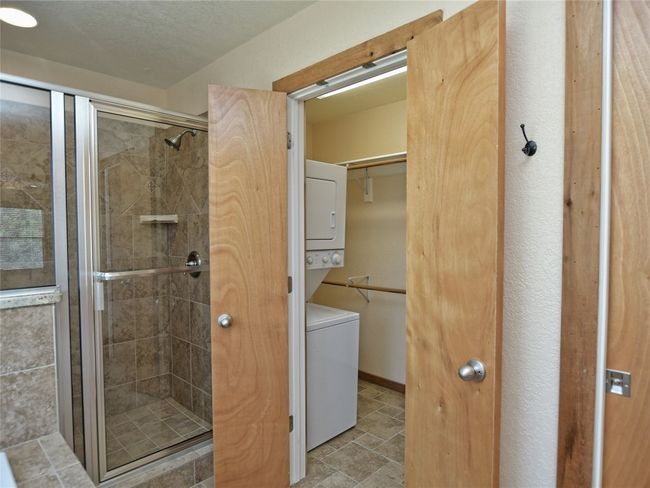 Stack Washer/Dryer space located in the primary bath walk-in closet. | Image 17