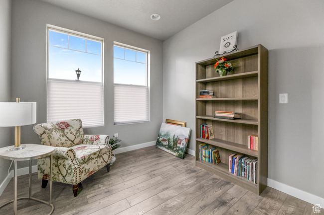 Living area with baseboards and wood finished floors | Image 7