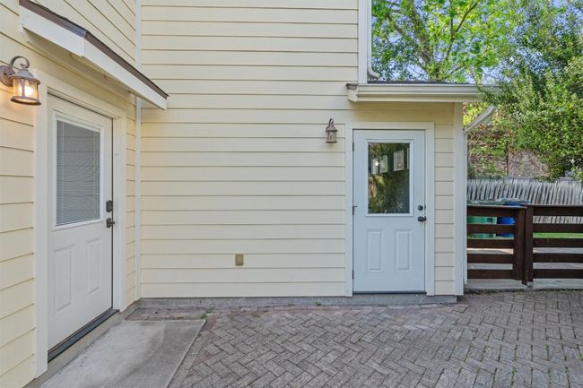 Doorway to property featuring fence and a patio | Image 26