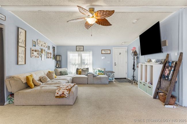 Spacious living area with plenty of room to entertain. | Image 11