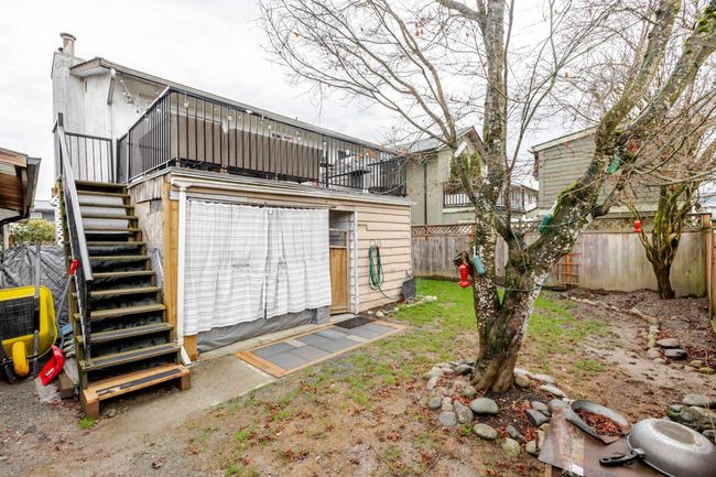 Back of house with stairway and a fenced backyard | Image 30