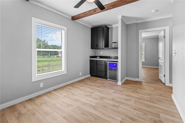 Flexible room with beverage cooler, sink, and microwave area | Image 15