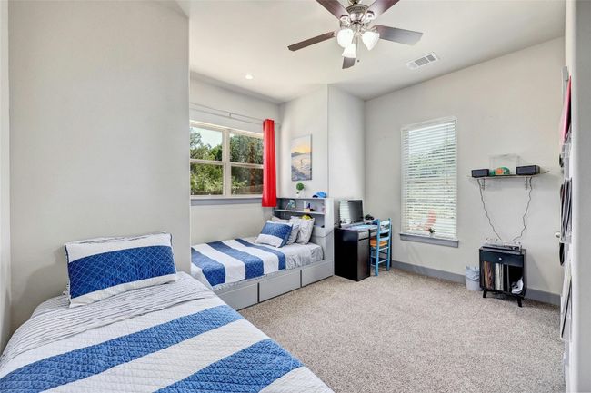 One of three oversized guest or kid bedrooms on the main floor. | Image 23