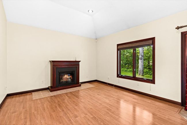 Vaulted Living Room features a cozy gas fireplace for those cool wintery nights. | Image 23