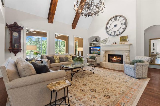The home has soaring ceilings throughout with lots of character and world class charm. The den has a vaulted ceiling with a wall of windows looking out to the natural setting of the private backyard... | Image 24